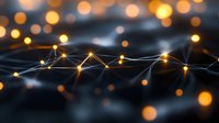 Glowing network connections with illuminated nodes on dark background, abstract technology concept with warm bokeh lights creating depth and atmosphere.