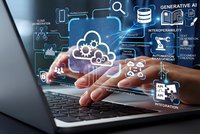 Business professional using laptop with cloud computing and AI technology interface overlay showing data management and digital transformation concepts.