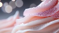 Delicate pink rose petals covered in sparkling water droplets with soft bokeh lights creating romantic atmosphere for wedding and love concepts.