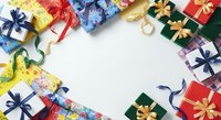 Colorful wrapped gift boxes with ribbons and bows arranged on white background, overhead view for holiday, celebration, and festive design projects.