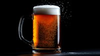 Amber beer mug with thick white foam head and condensation droplets against dark background, dramatic side lighting creates glowing effect in liquid.