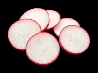 Fresh radish slices with vibrant pink skin and white flesh, isolated on transparent background. Ready for culinary designs, food packaging, recipe graphics, cooking blogs, restaurant menus, and nutritional content illustrations.