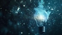 Glowing light bulb with magical blue smoke and sparkles emerging against dark background, symbolizing innovation and creative energy breakthrough.