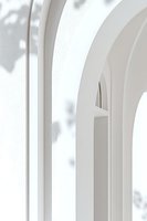 Minimalist white architectural arches with soft shadow play creating elegant curves and depth, suitable for modern interior design and architectural backgrounds.