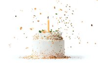 White cream birthday cake with golden candle and flying sprinkles on white background, festive celebration dessert with dynamic motion effect.