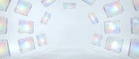 Iridescent glass cubes scattered on white surface, creating holographic light reflections for modern design, packaging, and digital backgrounds.