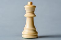 White queen chess piece on neutral gray background, strategic game concept for business and competition, isolated wooden figure with soft shadows.