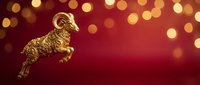 Golden duck figurine leaping against warm burgundy background with bokeh lights, suitable for luxury holiday decorations, festive greeting cards, and premium seasonal marketing materials.