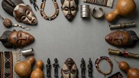 Traditional African cultural artifacts and tribal masks arranged in circular frame on neutral background for ethnic art projects.