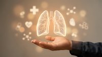 Hand holding glowing lungs with medical icons for respiratory health, pulmonology care, breathing wellness and lung disease prevention concepts.