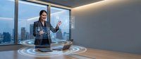 Woman in business attire presenting holographic data visualization in modern office with city skyline view, demonstrating digital technology and corporate innovation solutions.