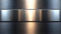 Brushed metal surface with alternating dark and light steel panels creating dramatic lighting effect and industrial texture background pattern.