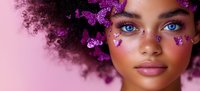 Young African American woman with natural curly hair and bright blue eyes, adorned with purple butterfly decorations on pink background, artistic fantasy makeup portrait.