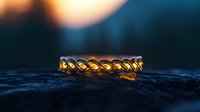 Celtic braided gold ring on dark textured surface with blurred sunset background, creating mystical mood with warm and cool color contrast. Macro jewelry photography.