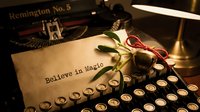 Vintage typewriter with paper reading Believe in Magic, mistletoe, and jingle bells in warm light, evoking Christmas nostalgia.