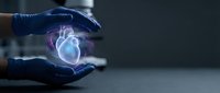 Medical professional in blue gloves protecting holographic heart model representing cardiology care and healthcare technology innovation.