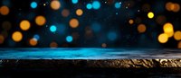 Dreamy night landscape with glowing blue and golden bokeh lights floating above dark mountain silhouette against starry sky background.