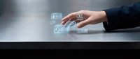 Business hand touching digital financial icons on modern surface representing fintech innovation and digital banking solutions.
