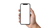 Hand holding modern smartphone with blank white screen mockup isolated on white background for app presentation and mobile interface design.