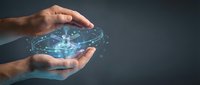 Male hands protecting glowing digital brain with neural network connections representing artificial intelligence and data protection in modern technology.