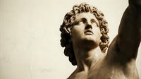 Classical marble statue of a young male figure with curly hair, gazing upward with arm raised, depicting strength and aspiration for art, history, and classical sculpture collections.
