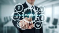 Professional businessman touching consulting button with interconnected business icons and gears in modern office environment for corporate strategy solutions.
