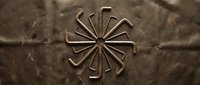 Copper pipes arranged in radial sunburst pattern on textured brown surface for plumbing construction industrial design projects.