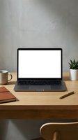 Modern laptop with blank white screen on wooden desk workspace with coffee mug, notebook, pen and plant for remote work and productivity mockup.