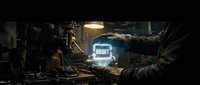 Futuristic holographic reset button glowing in cyberpunk workshop with advanced technology and digital interface elements for sci-fi design projects.