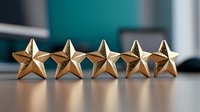 Five golden metallic stars in row on reflective surface against blurred background, representing excellence rating, achievement and quality review system.