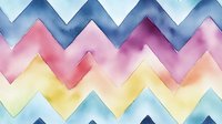 Watercolor chevron pattern in soft pastel colors of blue, pink, purple and yellow creates seamless geometric background for modern design projects and textiles.
