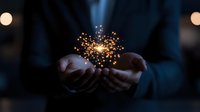 Magical glowing sparkles floating above cupped hands in dark atmosphere, creating mystical illumination effect against blurred background with bokeh lights.