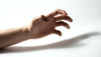 Close-up of an adult male hand with medium skin tone reaching forward against white background, isolated for design use on merchandise and promotional materials.