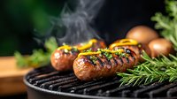 Grilled sausages with herbs and spices smoking on barbecue grill, fresh rosemary garnish, dark moody food photography with selective focus.