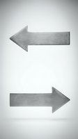 Brushed metal arrow signs pointing left and right directions isolated on white background for navigation and directional signage applications.