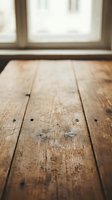 Empty wooden floor planks with rustic texture and natural grain patterns near bright window, creating warm interior space for product placement and design mockups.
