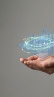 Hand holding holographic digital city model with glowing network connections and transparent buildings, representing smart city technology, urban planning, and digital innovation for business solutions.