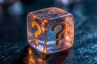Glowing transparent dice with question mark symbols captured in macro photography against dark background, mysterious orange light illuminates crystal cube.