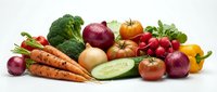 Fresh organic vegetables collection with carrots, broccoli, tomatoes, onions, radishes and peppers arranged on white background for healthy cooking and nutrition.
