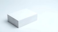White blank paper stack corner view on light background for office supplies and printing materials.