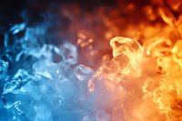 Dramatic contrast of orange and blue smoke creating abstract background with mystical atmosphere, suitable for creative design projects and artistic compositions.