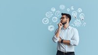 Young Middle Eastern businessman in white shirt thinking with illustrated idea icons and gears floating around head on light blue background. Creative problem solving concept.