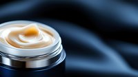 Luxurious anti-aging cream in silver jar on dark background with soft focus and dramatic lighting. Premium skincare product photography for beauty and cosmetics marketing.