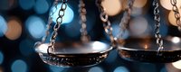 Vintage brass scales of justice on dark background with blue bokeh lights, symbolizing law, judgment, and legal balance in courtroom setting.