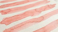Coral pink watercolor brush strokes on white paper creating organic striped pattern for artistic backgrounds and creative design projects.