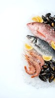 Fresh seafood selection with fish, shrimp and mussels on ice with lemon slices for restaurant menu, cooking and culinary preparation on white background.