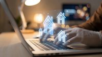 Smart home automation concept with wireless connectivity icons floating above laptop keyboard in modern workspace environment for IoT technology applications.