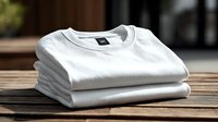 Neatly folded white cotton t-shirts stacked on wooden surface, ready for casual wear or custom printing for promotional merchandise.