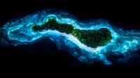 Tropical island surrounded by glowing turquoise waters and mystical blue mist, aerial view showing curved coastline and lush green forest landscape. For travel designs.