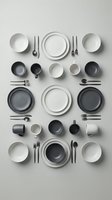 Modern minimalist tableware collection with plates, bowls, cups and cutlery arranged in geometric pattern on neutral background for kitchen design.